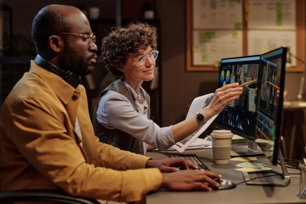 manager-discussing-montage-with-colorist-2025-03-13-05-51-56-utc